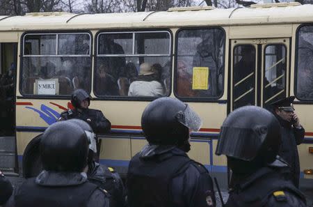 People, who were detained during an opposition protest calling for Russian President Vladimir Putin not to run for another presidential term next year, are seen inside a bus in St. Petersburg, Russia, April 29, 2017. REUTERS/Anton Vaganov