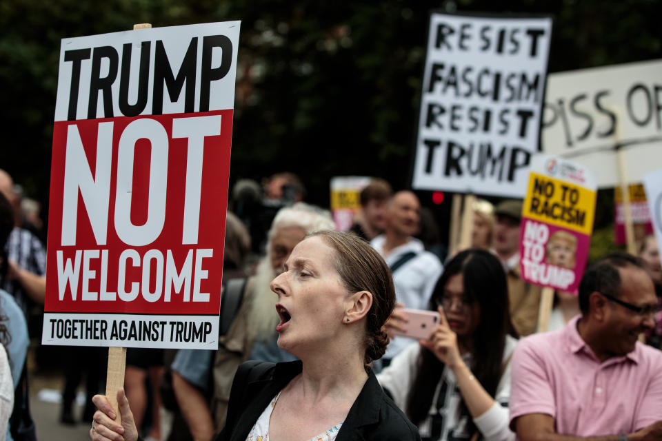 <p>Protesters chant and wave placards during a demonstration outside Winfield House, the London residence of U.S. Ambassador Woody Johnson, where President Donald Trump and first lady Melania Trump are staying tonight on July 12, 2018 in London, Britain. (Photo: Jack Taylor/Getty Images) </p>