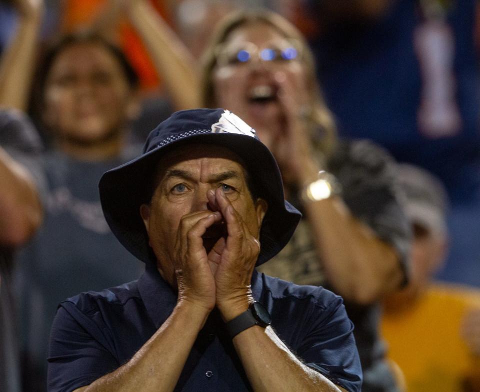 UTEP fans begin cheering as a targeting call gets overturned as they face UNLV on on Sept. 23, 2023 at the Sun Bowl.