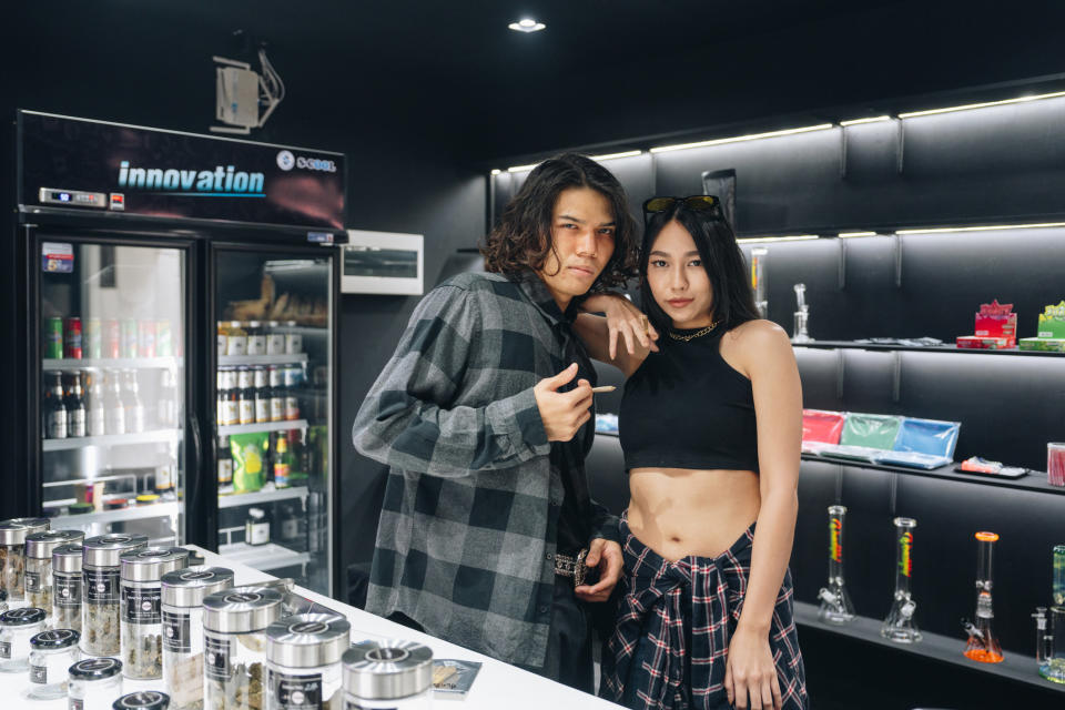 Two workers in a cannabis store