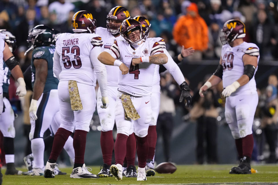 Washington Commanders quarterback Taylor Heinicke (4) reacts during the second half of an NFL football game against the Philadelphia Eagles, Monday, Nov. 14, 2022, in Philadelphia. (AP Photo/Matt Rourke)