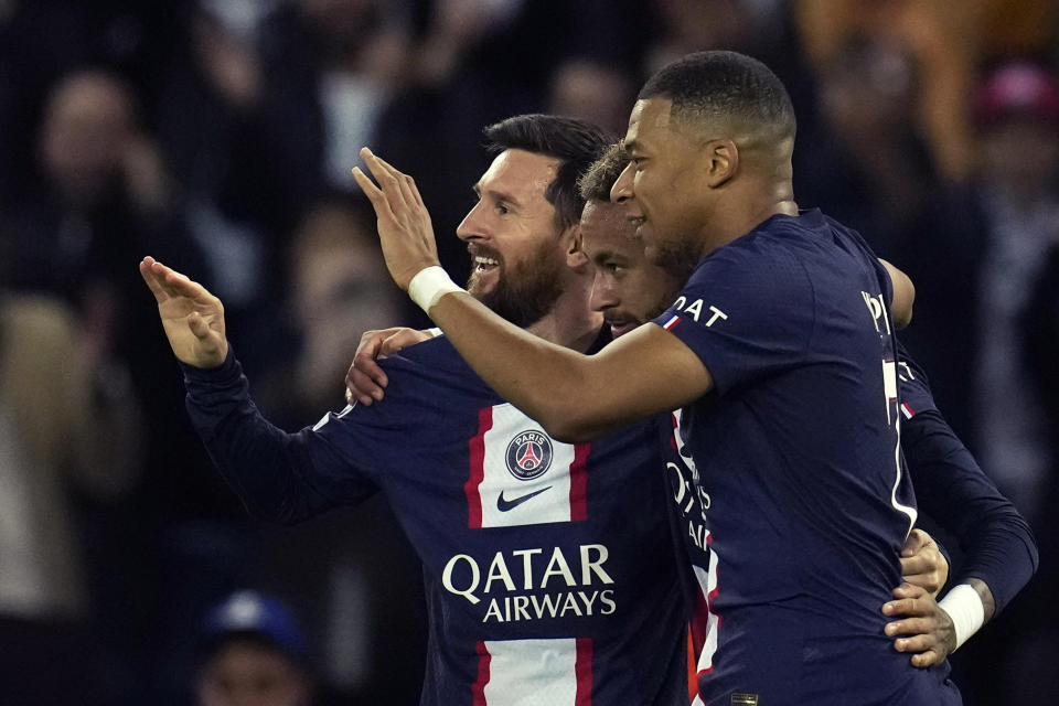 FILE - PSG's Neymar, center, celebrates PSG's Lionel Messi, left, and PSG's Kylian Mbappe, right, after scoring his side's third goal during the Champions League Group H soccer match between Paris Saint Germain and Maccabi Haifa, at the Parc des Princes stadium, in Paris, France, Tuesday, Oct. 25, 2022. Mbappe has told Paris Saint-Germain he will leave the club at the end of the season, a source told The Associated Press on Thursday, Feb. 15, 2024. (AP Photo/Christophe Ena, File)