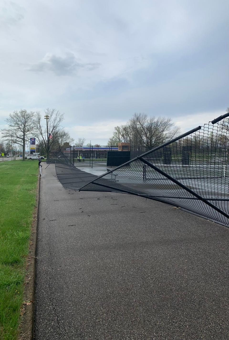 The Central tennis court fence overlooking First Avenue was damaged in last month’s severe storms.