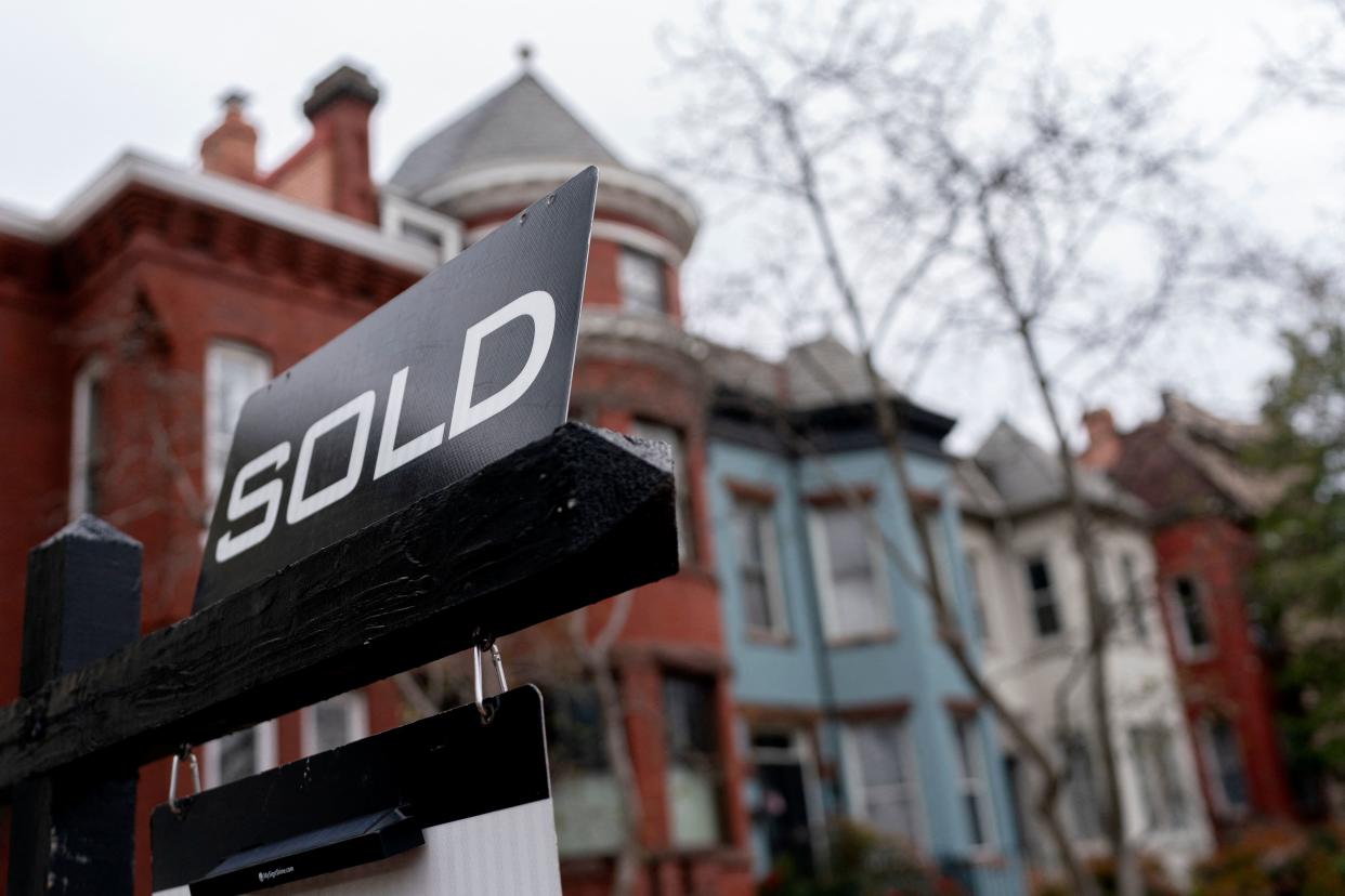 A sold sign is posted in front of a house in Washington, DC, on February 26, 2022. (Photo by Stefani Reynolds / AFP) (Photo by STEFANI REYNOLDS/AFP via Getty Images)