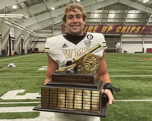 Boone Bonnema with the victory cannon after Western Michigan beat Central Michigan.