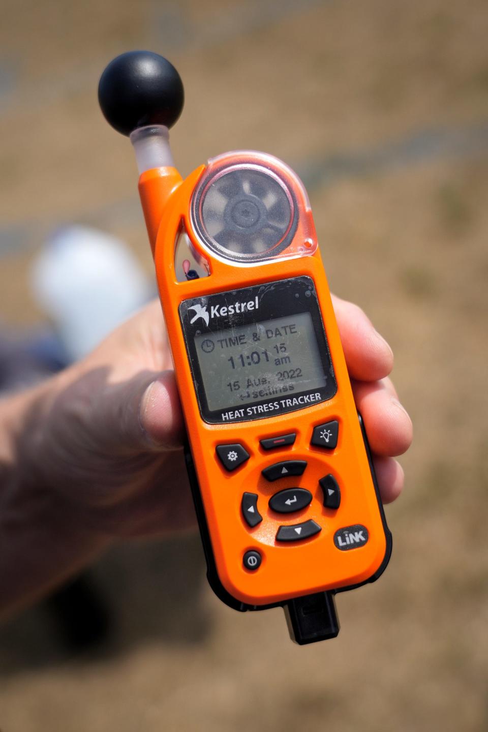 Kestrel 5400 Heat Stress Tracker on the 1st day of high school football practice at Barrington HS.  The device measures Wet Bulb Temperature, Wind Speed, Relative Humidity, Heat Stress Index, Wind Chill and Altitude among other features.   [The Providence Journal / Kris Craig]  