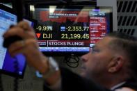 Traders on the floor of the New York Stock Exchange (NYSE) after the close of trading in New York