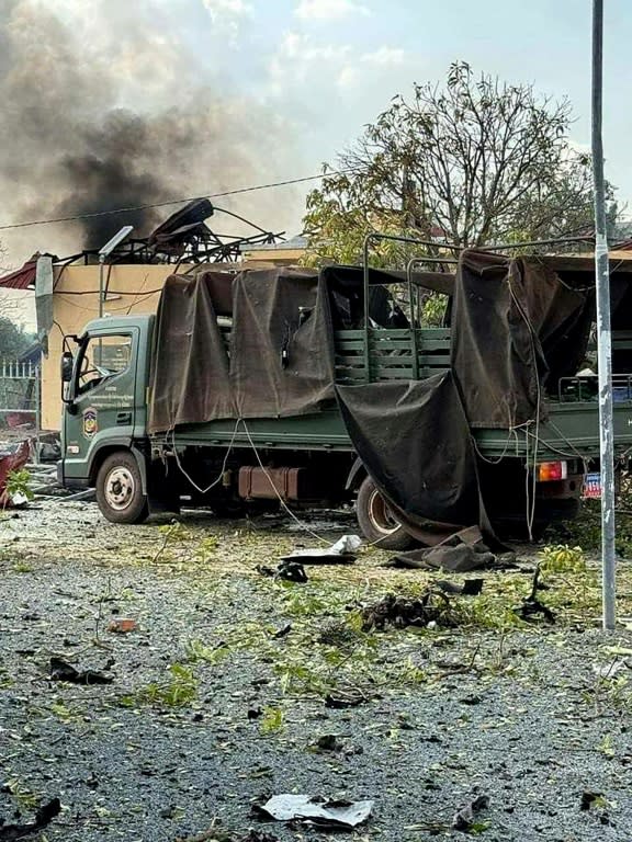 A damaged military truck following an explosion at an army base in Cambodia (-)