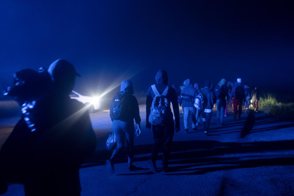 Migrants begin their walk north from the community of La Lima in southern Veracruz state, Mexico, early Wednesday, Nov. 24, 2021. The Mexican government has recently opted for a new strategy to relieve pressure on Tapachula, the city on its southern border with Guatemala where tens of thousands of migrants accumulate, and to deactivate the caravans that have emerged in recent months: grant humanitarian visas and offer transfers to other states. (AP Photo/Felix Marquez)