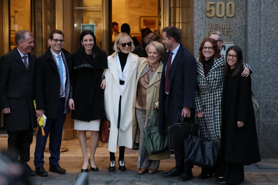 E. Jean Carroll surrounded by her defense team after winning an $83 million defamation verdict against Donald Trump.