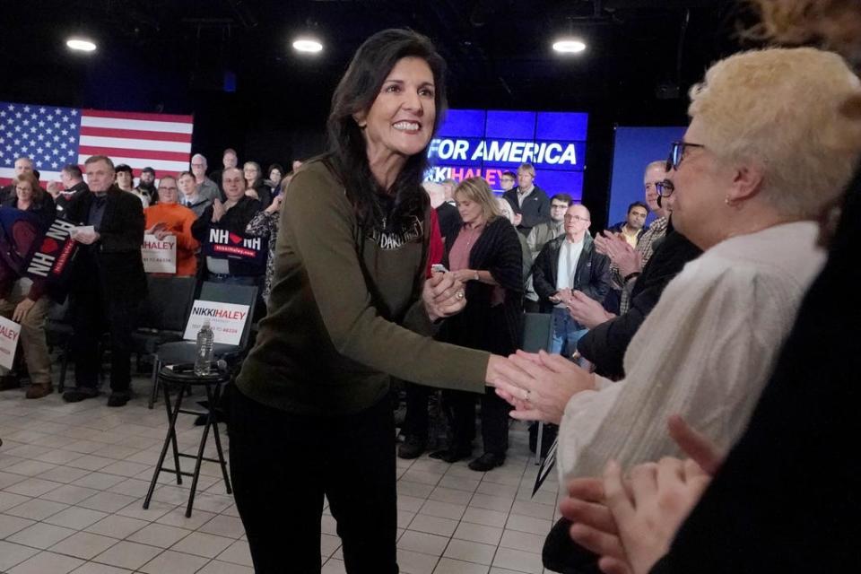 Republican presidential candidate, former ambassador to the United Nations Nikki Haley shakes hands with guests during a campaign stop Monday, March 27, 2023, in Dover, N.H.