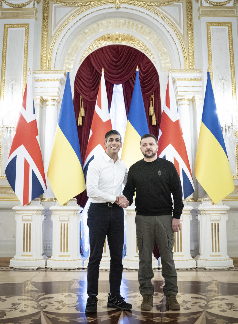 Prime Minister Rishi Sunak shakes hands with President Volodymyr Zelenskyy during a visit to the Presidential Palace in Kyiv, Ukraine, to announce a major new package of £2.5 billion in military aid to the country over the coming year, Friday, Jan. 12, 2024. (Stefan Rousseau/Pool via AP)