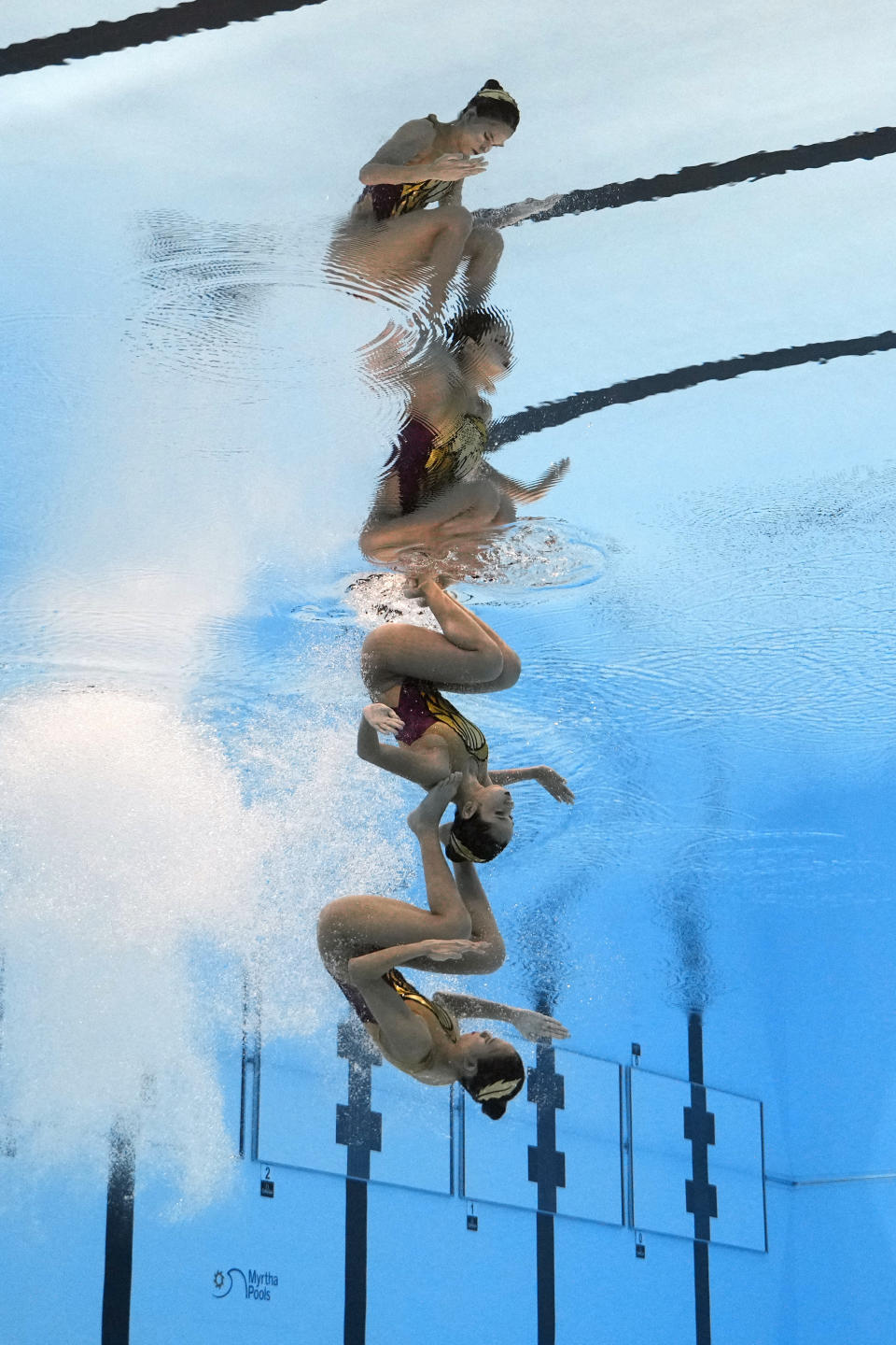 Hilda Tri Julyandra and Gabrille Permata Sari of Indonesia competes in the women's duet technical of artistic swimming at the World Aquatics Championships in Doha, Qatar, Friday, Feb. 2, 2024. (AP Photo/Lee Jin-man)