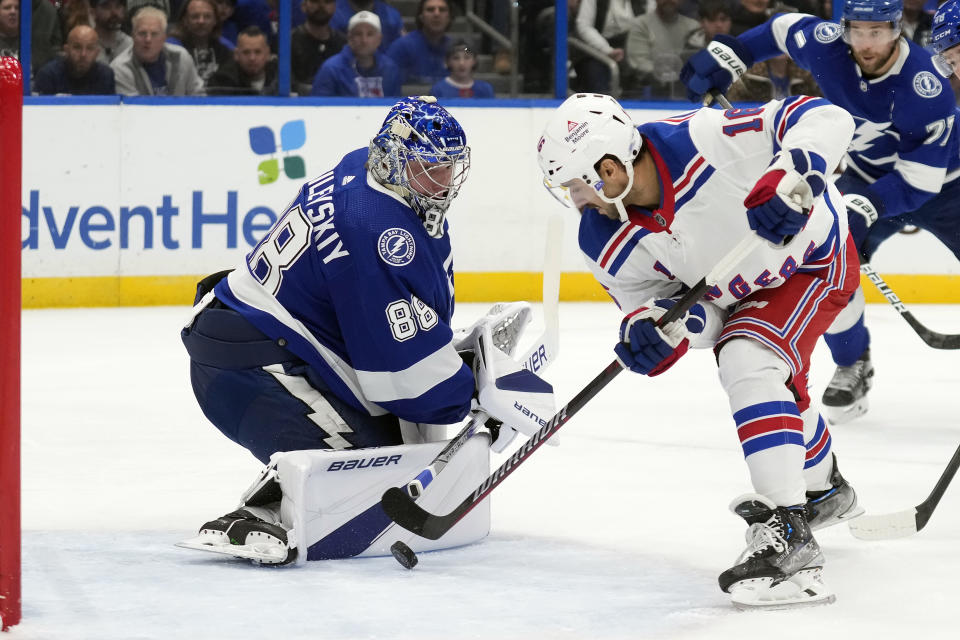 New York Rangers center Vincent Trocheck (16) scores past Tampa Bay Lightning goaltender Andrei Vasilevskiy (88) during the first period of an NHL hockey game Saturday, Dec. 30, 2023, in Tampa, Fla. (AP Photo/Chris O'Meara)