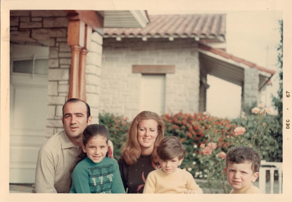 Faena, seen in a yellow sweater, with his family in December 1967.