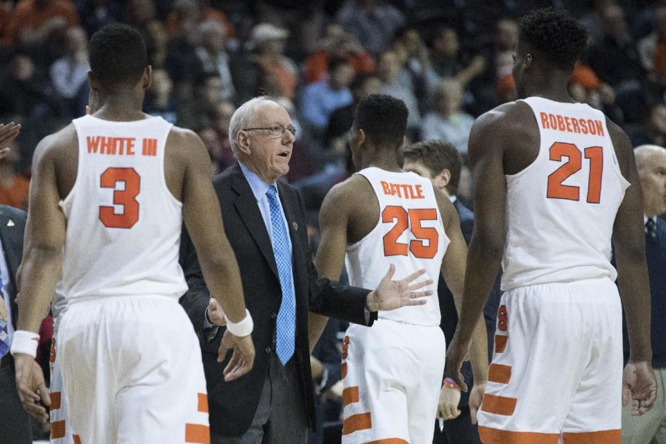 Syracuse head coach Jim Boeheim, second from left, gestures as his team comes in to the bench during a time out in the second half of an NCAA college basketball game against the Miami in the Atlantic Coast Conference tournament, Wednesday, March 8, 2017, in New York. Miami won 62-57. (AP Photo/Mary Altaffer)