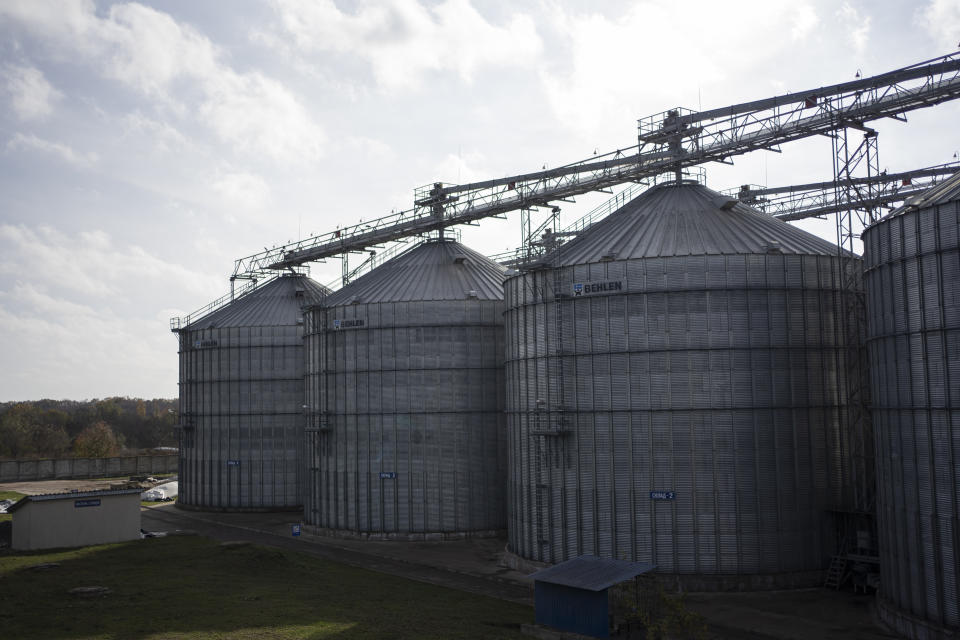 A general view of silos filled of grain at a handling and storage facility in central Ukraine, Friday, Nov. 10, 2023. In recent months, an increasing amount of grain has been unloaded from overcrowded silos and is heading to ports on the Black Sea, set to traverse a fledgling shipping corridor launched after Russia pulled out of a U.N.-brokered agreement this summer that allowed food to flow safely from Ukraine during the war. (AP Photo/Hanna Arhirova)