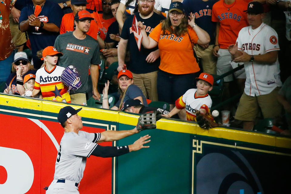 Carson Riley tries to catch Carlos Correa’s homer in Game 2 of the ALCS. (Getty Images)