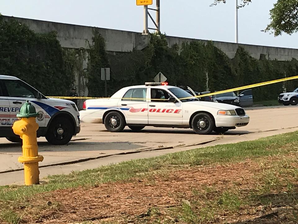 Shreveport police cars are pictured at a crime scene.