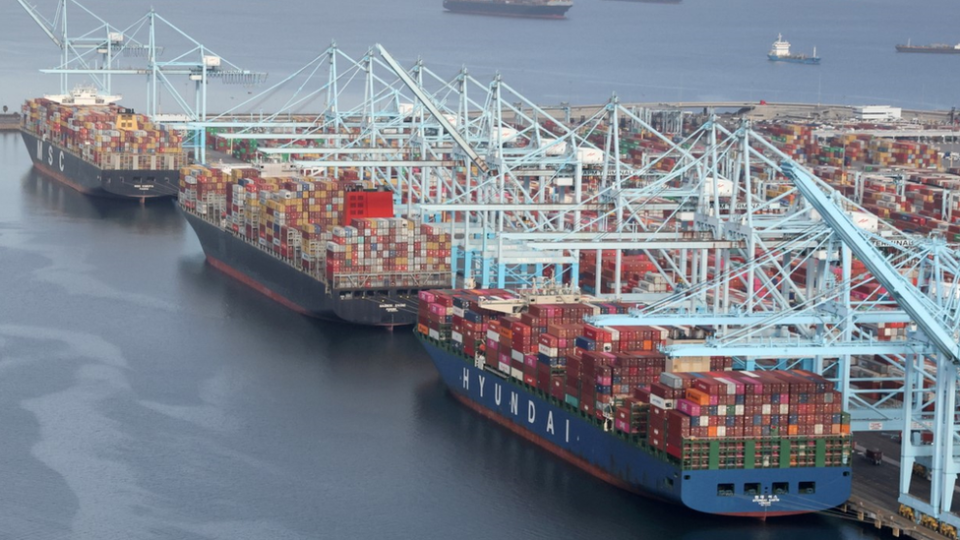 Three full container ships waiting to be unloaded at Los Angeles port