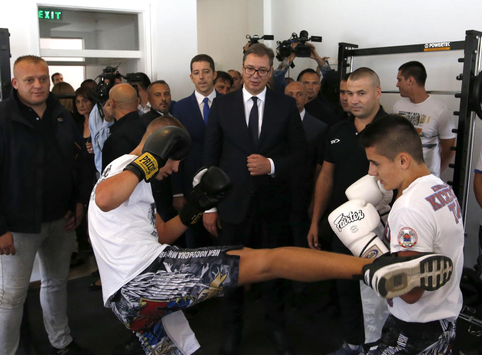 Serbian President Aleksadar Vucic, center, visits a recreation youth center near the village of Gazivode, Kosovo, Saturday, Sept. 8, 2018. Vucic is on a two day visit to Kosovo. (AP Photo/Darko Vojinovic)