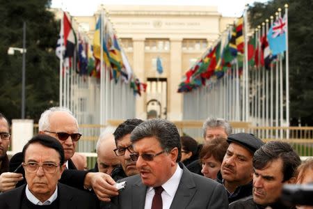 Salim al-Muslat (C) spokesman for the High Negotiations Committee (HNC) and Riad Naasam Agha, member of HNC deliver a statement during the Geneva Peace talks outside the United Nations in Geneva, Switzerland, February 2, 2016. REUTERS/Pierre Albouy