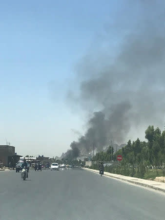 A cloud of smoke is seen after an explosion in Kandahar, Afghanistan May 22, 2018 in this picture obtained from social media. AZEEM ZMARIAL/via REUTERS