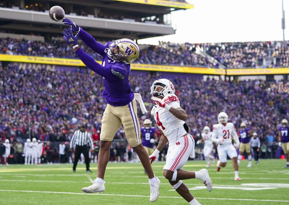 Washington wide receiver Rome Odunze, left, can’t bring in a pass in the end zone against Utah cornerback JaTravis Broughton (4) during the first half of an NCAA college football game Saturday, Nov. 11, 2023, in Seattle. | Lindsey Wasson, Associated Press