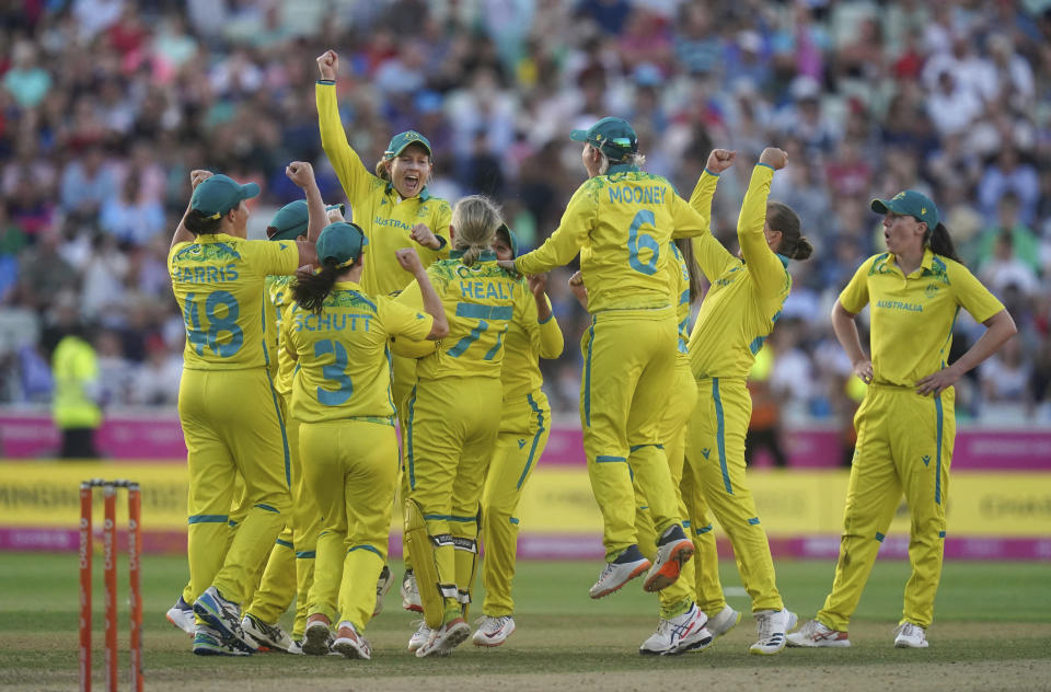 Australia players celebrate winning the gold medal in the cricket final after defeating India at Edgbaston Stadium on day ten of 2022 Commonwealth Games in Birmingham, England, Sunday Aug. 7, 2022. (Adam Davy/PA via AP)