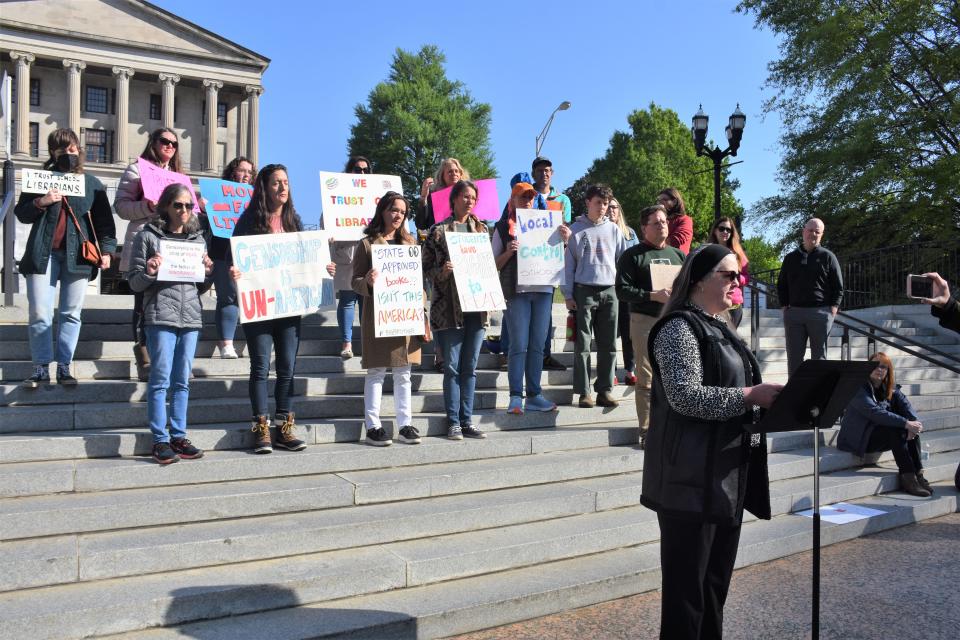 Local mother Anna Caudill speaks out at a press conference on Legislative Plaza in Nashville, Tenn. on Wednesday, April 27, 2022., where library advocates protested against a bill currently being considered by state lawmakers.
