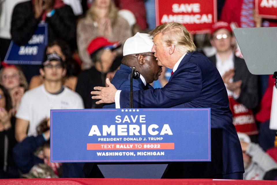 Republican House of Representative candidate John Gibbs shakes hands with former President Donald Trump during a rally in Washington Township on April 2, 2022.