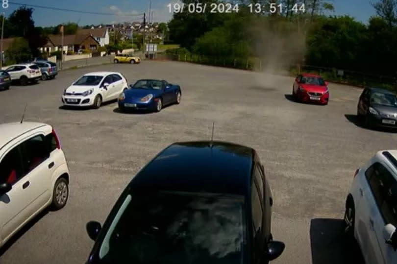 The moment the dust devil formed in the car park