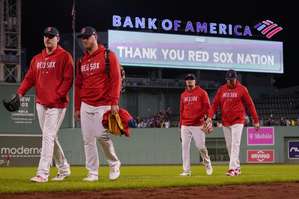 Boston Red Sox pitchers walk from the bullpen following the team's 5-0 loss to the Tampa Bay Rays in the team's final home game of the season, at Fenway Park on Wednesday, Sept. 27, 2023, in Boston. (AP Photo/Charles Krupa)