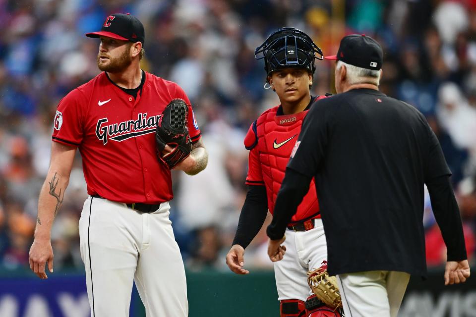 Sep 28, 2024; Cleveland, Ohio, USA; Cleveland Guardians starting pitcher Ben Lively (39) looks away as pitching coach Carl Willis (51) walks to the mound during the second inning against the Houston Astros at Progressive Field. Mandatory Credit: Ken Blaze-Imagn Images