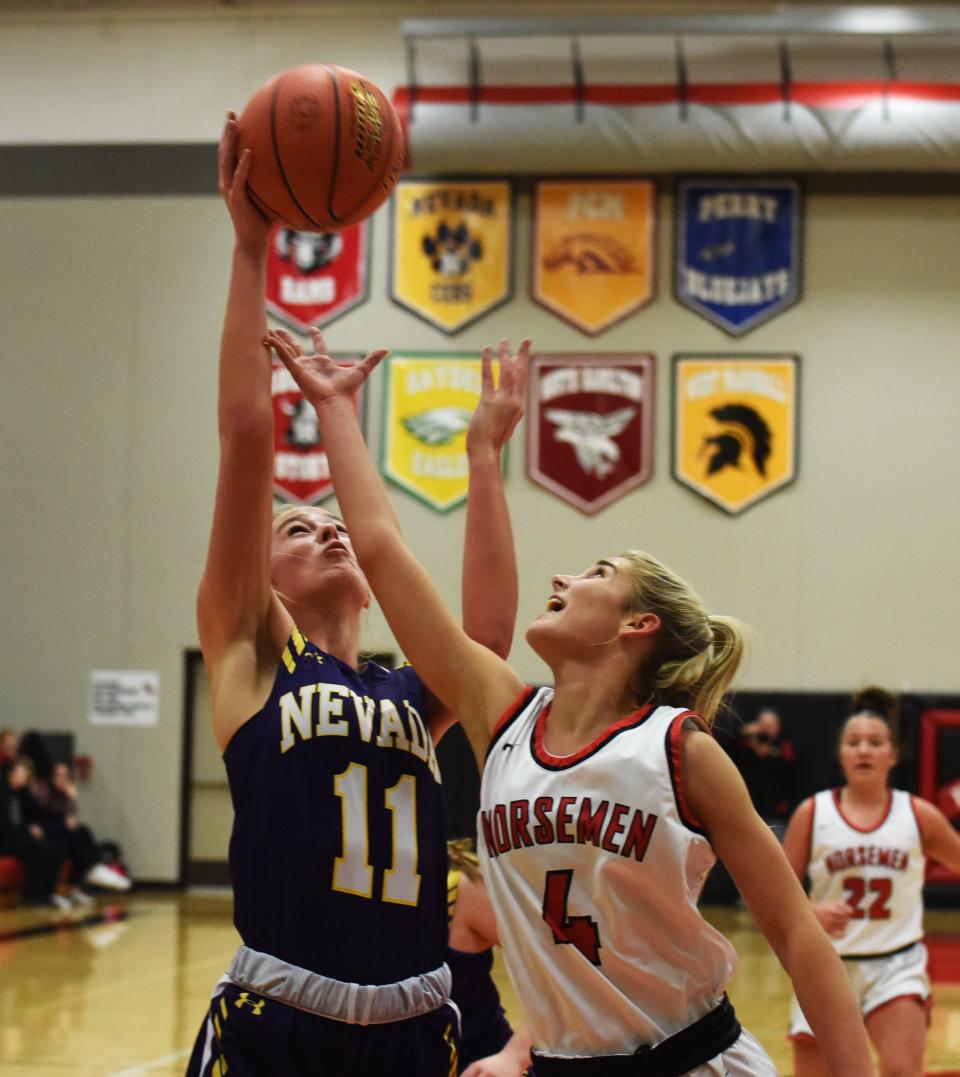 Nevada's Avery Hinson beats Roland-Story's Elizabeth Ihle for a rebound during the first half of the Cubs' 50-39 loss to the Norse Jan. 17 in Story City.