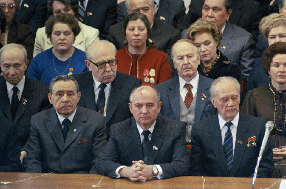 FILE - Mikhail Gorbachev, center, attends the International Women' s Day Gala at the Bolshoi Theatre in Moscow on March 7, 1985. Left to right are: Politburo members Geidar Aliey, Mikhail Solomentsev, Viktor Grishin, Andrei Gromyko, Mikhail Gorbachev and Nikolai Tikhonov. Russian news agencies are reporting that former Soviet President Mikhail Gorbachev has died at 91. The Tass, RIA Novosti and Interfax news agencies cited the Central Clinical Hospital. (AP Photo/Boris Yurchenko, File)