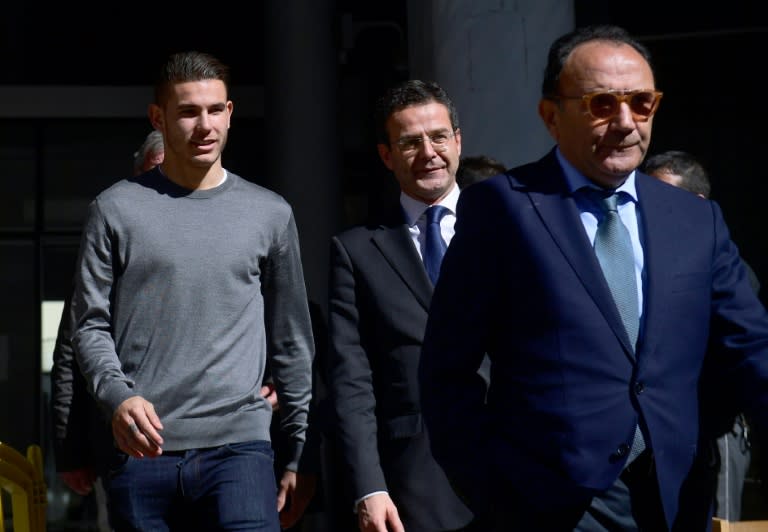 Atletico Madrid's French defender Lucas Hernandez (L) leaves Madrid's Criminal Court Nr. 35, which specialises in domestic violence, on February 21, 2017