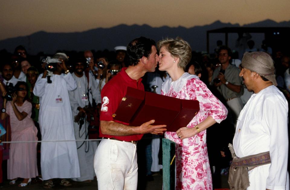 Princess Diana kisses Prince Charles