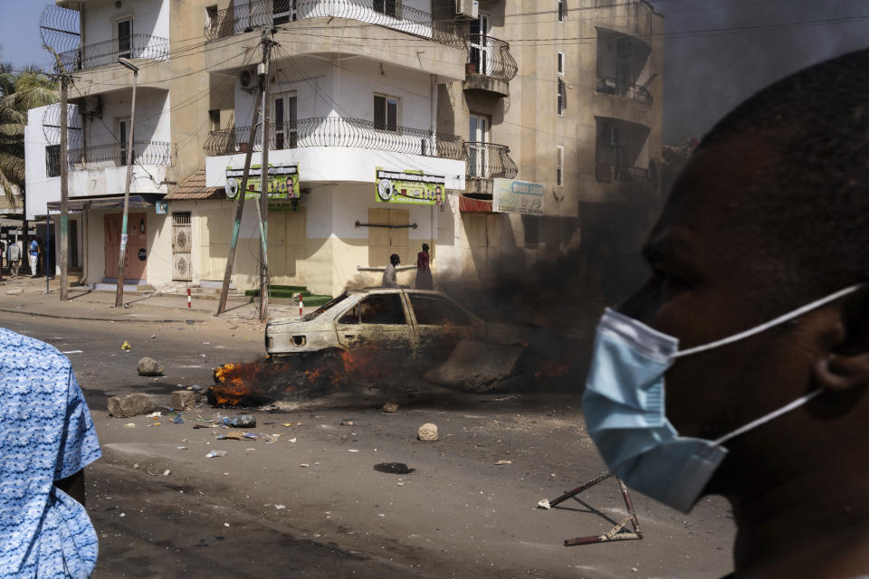 Demonstrators protest President Macky Sall decision to postpone the Feb. 25 vote, citing an electoral dispute between the parliament and the judiciary regarding some candidacies in Dakar, Senegal, Friday, Feb. 9, 2024. Opposition leaders and candidates rejected the decision, calling it a "coup." (AP Photo/Stefan Kleinowitz)