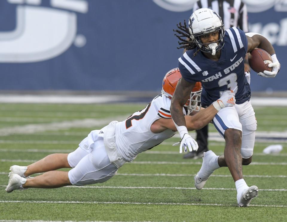 Utah State running back Rahsul Faison (3) carries the ball as Idaho State safety Mason Young (22) defends during the first half of an NCAA college football game Saturday, Sept. 9, 2023, in Logan, Utah. | Eli Lucero/The Herald Journal via AP