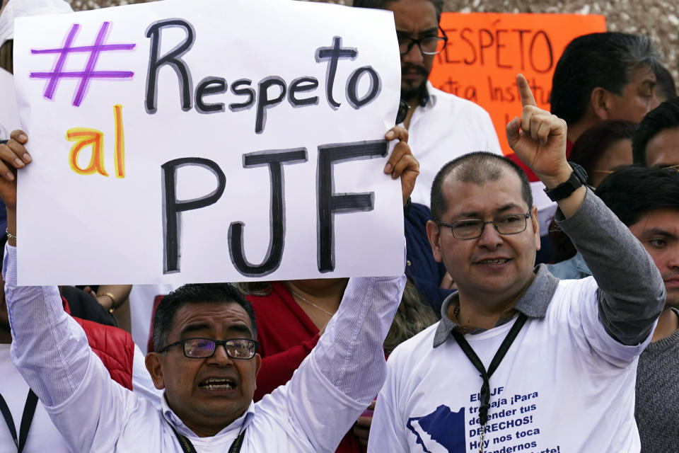 Judicial workers protest funding cuts to next year's judiciary budget as they start a national, two-week strike, outside their offices in Mexico City, Thursday, Oct. 19, 2023. The sign reads in Spanish "Respect the Federal Judicial Power." (AP Photo/Marco Ugarte)