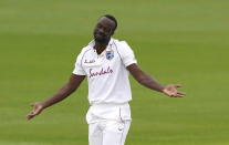 West Indies' Kemar Roach reacts after appealing unsuccessfully for the wicket of England's Dom Sibley during the first day of the second cricket Test match between England and West Indies at Old Trafford in Manchester, England, Thursday, July 16, 2020. (AP Photo/Jon Super, Pool)