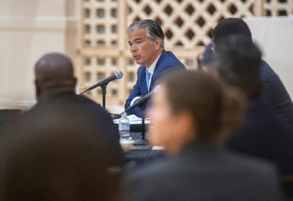 California Attorney General Rob Bonta speaks June 28 at a hate crimes roundtable discussion at the Stockton Civic Memorial Auditorium in downtown Stockton. The people in the foreground are blurred which helps to emphasize Bonta who is in focus.