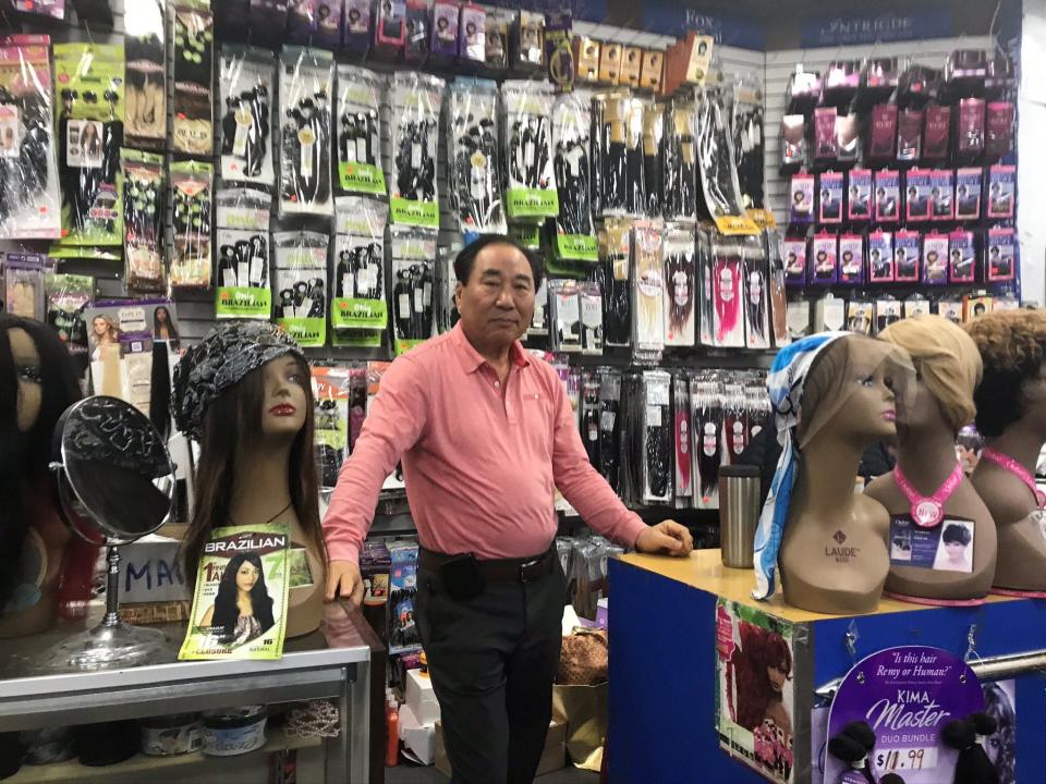 Don Pang stands in his beauty supply store at the Metro Shopping Plaza. He recently sold the plaza to Beruk Properties Inc.