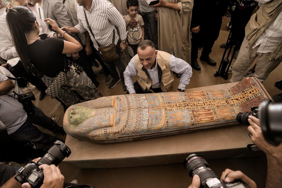Mostafa Waziri, secretary-general of the Supreme Council of Antiquities, displays a recently unearthed ancient wooden sarcophagus in Saqqara, Egypt on Saturday, May 27, 2023.