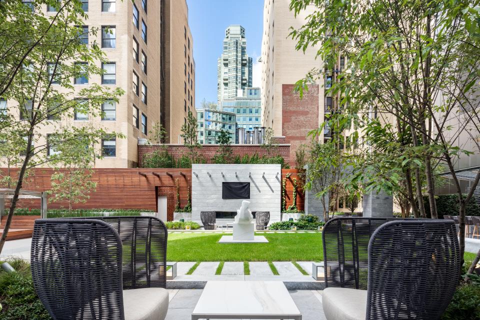 an outdoor green space and chairs on the 14th floor of luxury skyscraper Central Park Tower