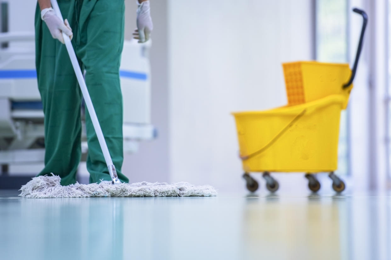 Clean and sanitize, Cleaner, Hospital cleaning,Cleaning the hospital floor. Floor care and cleaning services with washing mop in sterile factory or clean hospital.