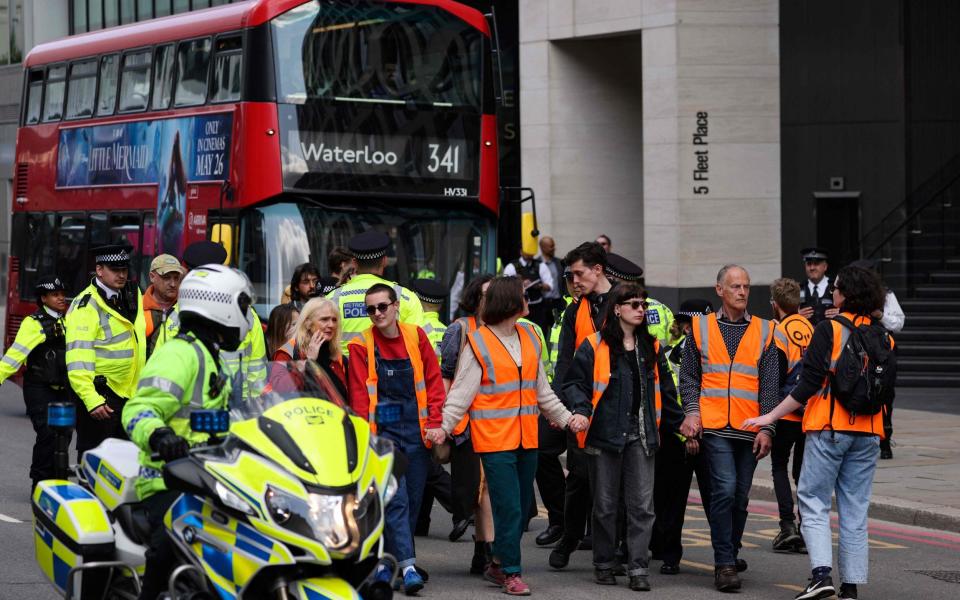 Just Stop Oil climate activists block the traffic as they slow march on the roads in May 2023