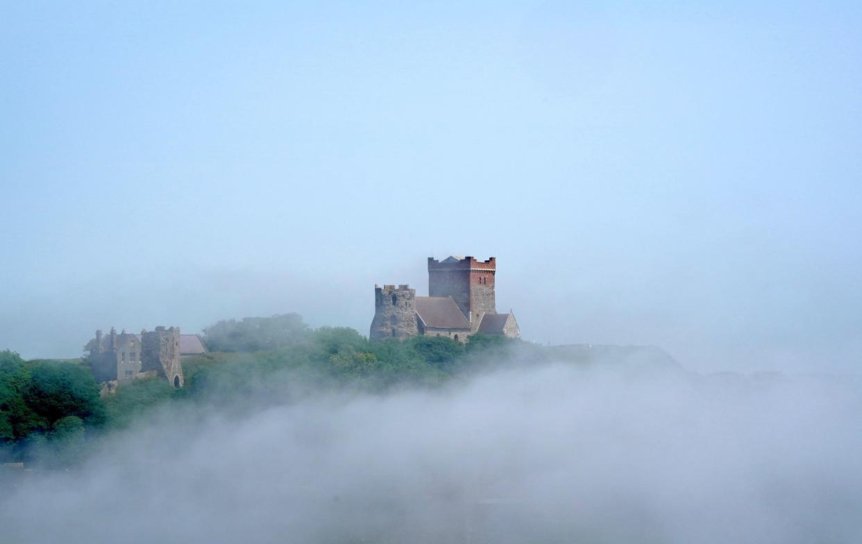 St Mary in Castro church is shrouded in fog upon the White Cliffs in Dover, Kent. (PA)