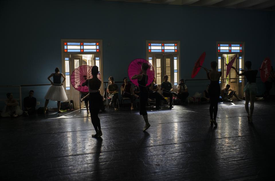 Members of the national ballet of Cuba dance during an practice session directed by Viengsay Valdes in Havana, Cuba, Thursday, Dec. 12, 2019. Valdes, the new head of Cuba's legendary National Ballet, says she hopes to renew the institution after the death of long-time director Alicia Alonso by introducing new choreography and appearances by dancers who have emigrated to other companies. (AP Photo/Ramon Espinosa)